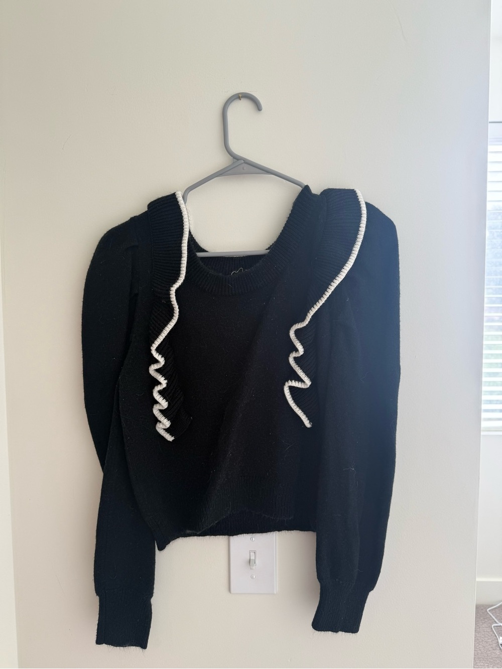 Black Ruffle-Trim Sweater with White Accents